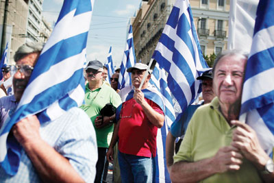 اليونان تلقت تأكيدا بشأن عدم تأجيل تقرير المفتشين